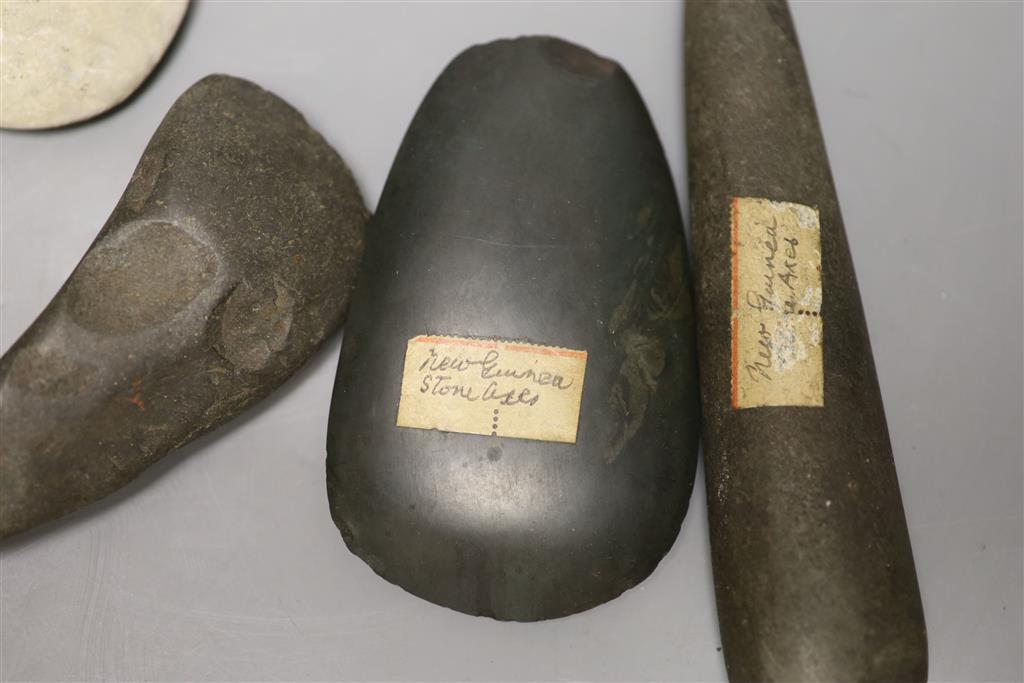 A group of stone adze hand tools, three 19th century Papua New Guinea, each labelled New Guinea, collected before 1950,